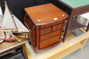 A magazine table fitted five drawers