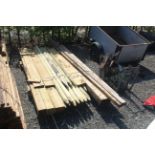 A quantity of various fence posts, fence poles, sa