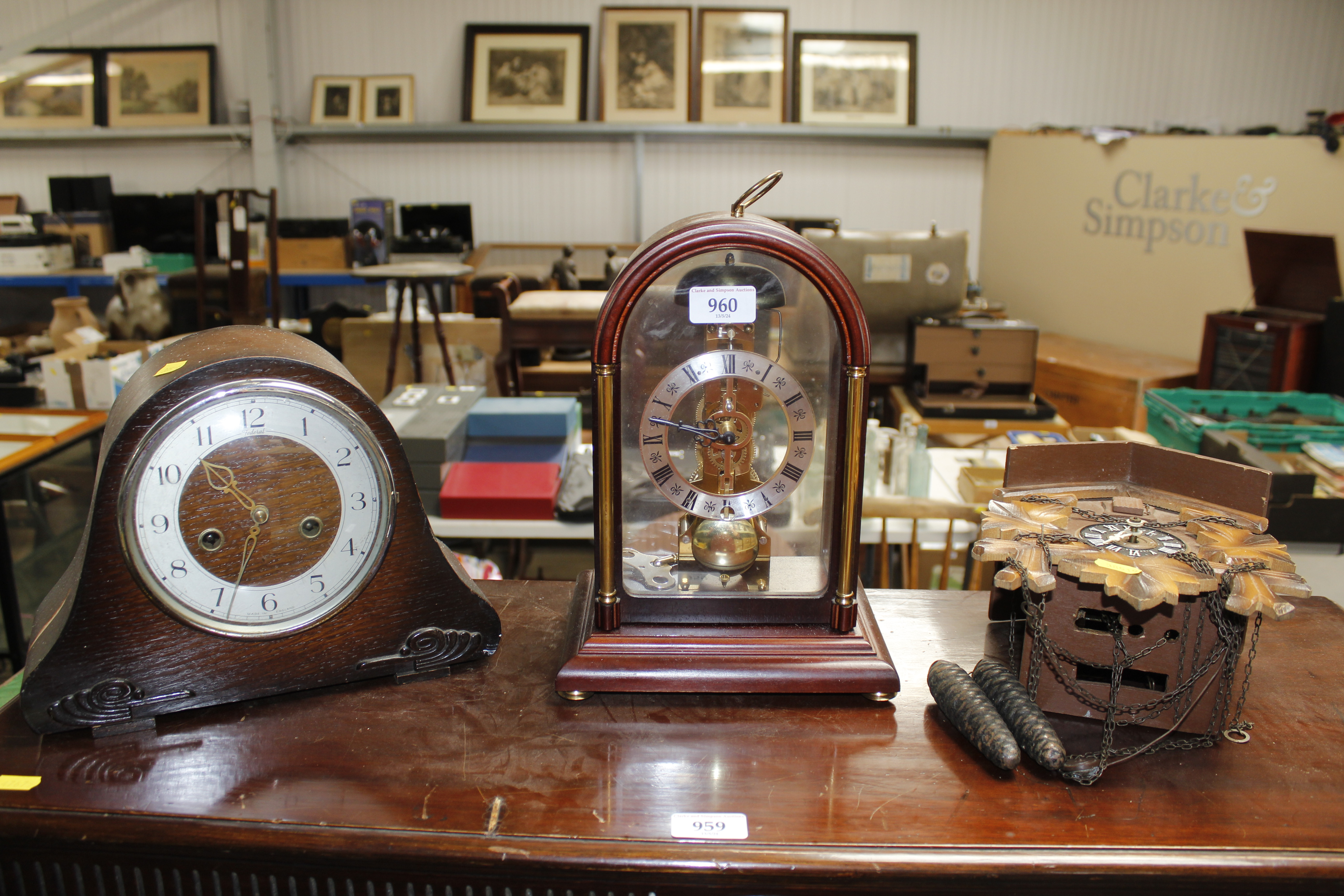 A cuckoo clock, an oak cased two hole mantel clock