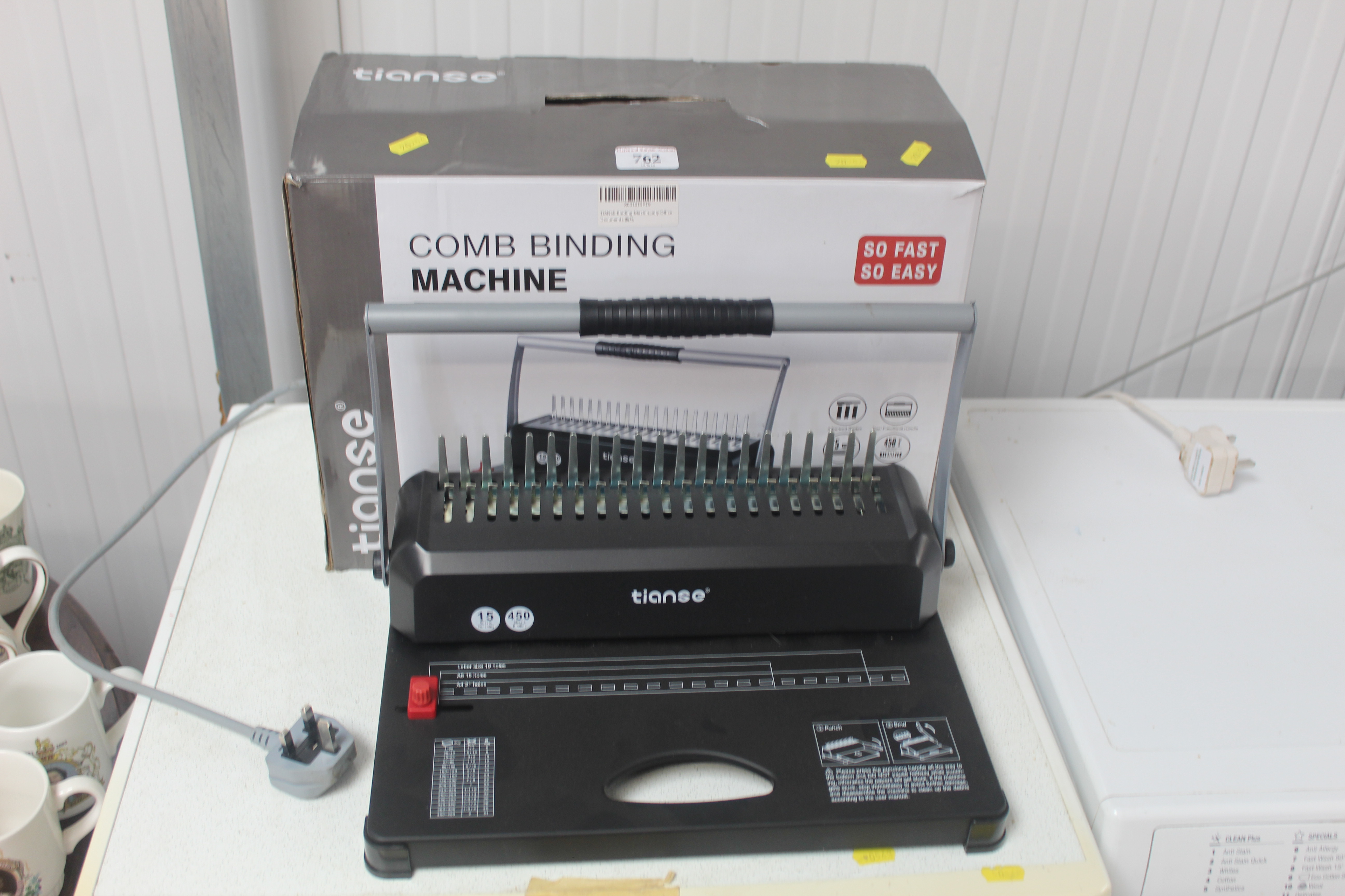 A comb binding machine