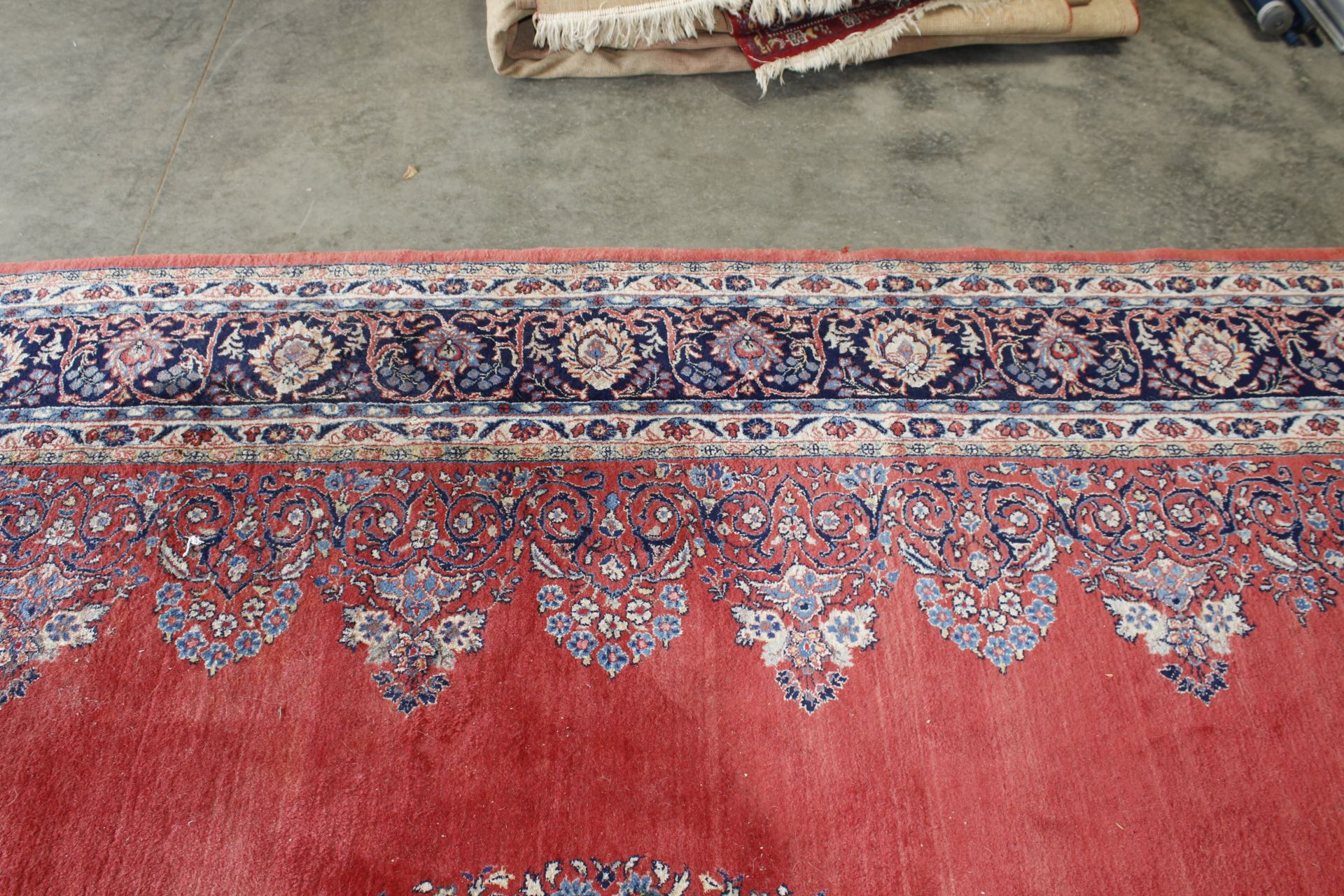 An approx. 12'9" x 9'8" red patterned rug AF - Image 7 of 10