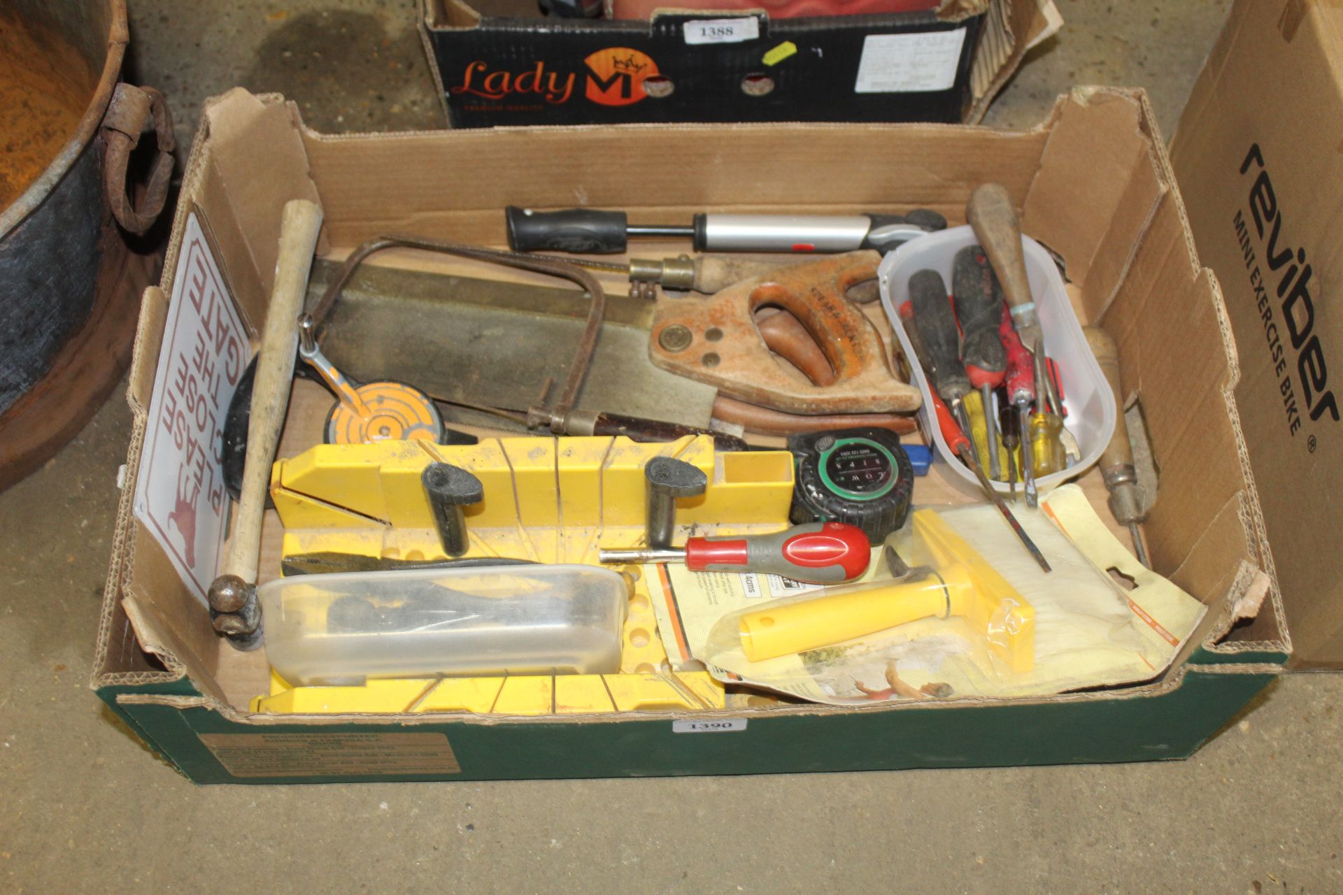 A box of various tools to include Spear & Jackson