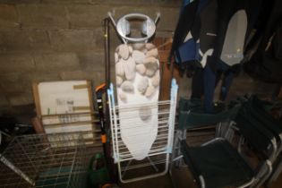 A folding ironing board and a folding metal clothe