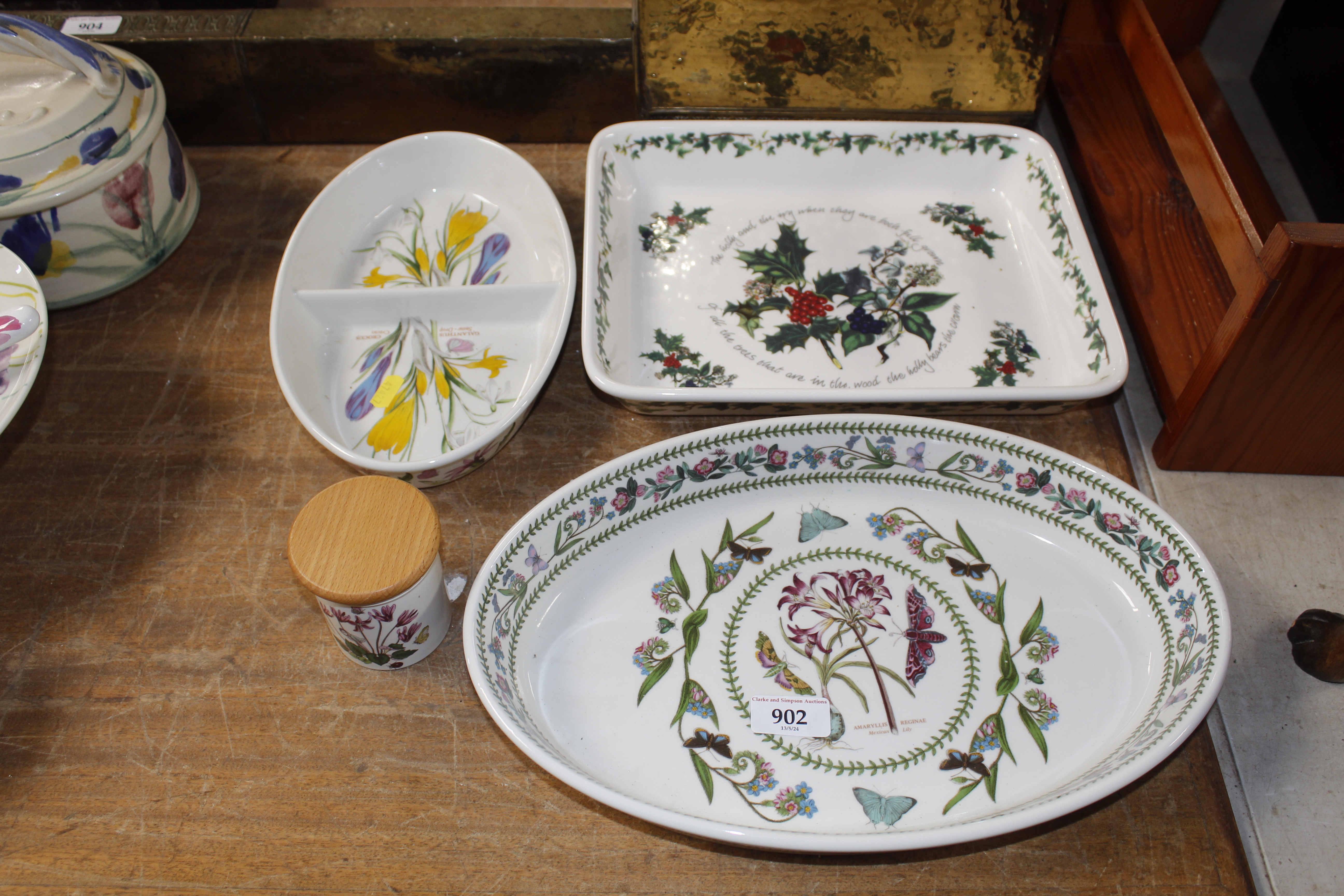 A collection of Portmeirion dishes and a storage j