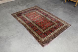 An approx. 6'9" x 4'5" patterned rug AF