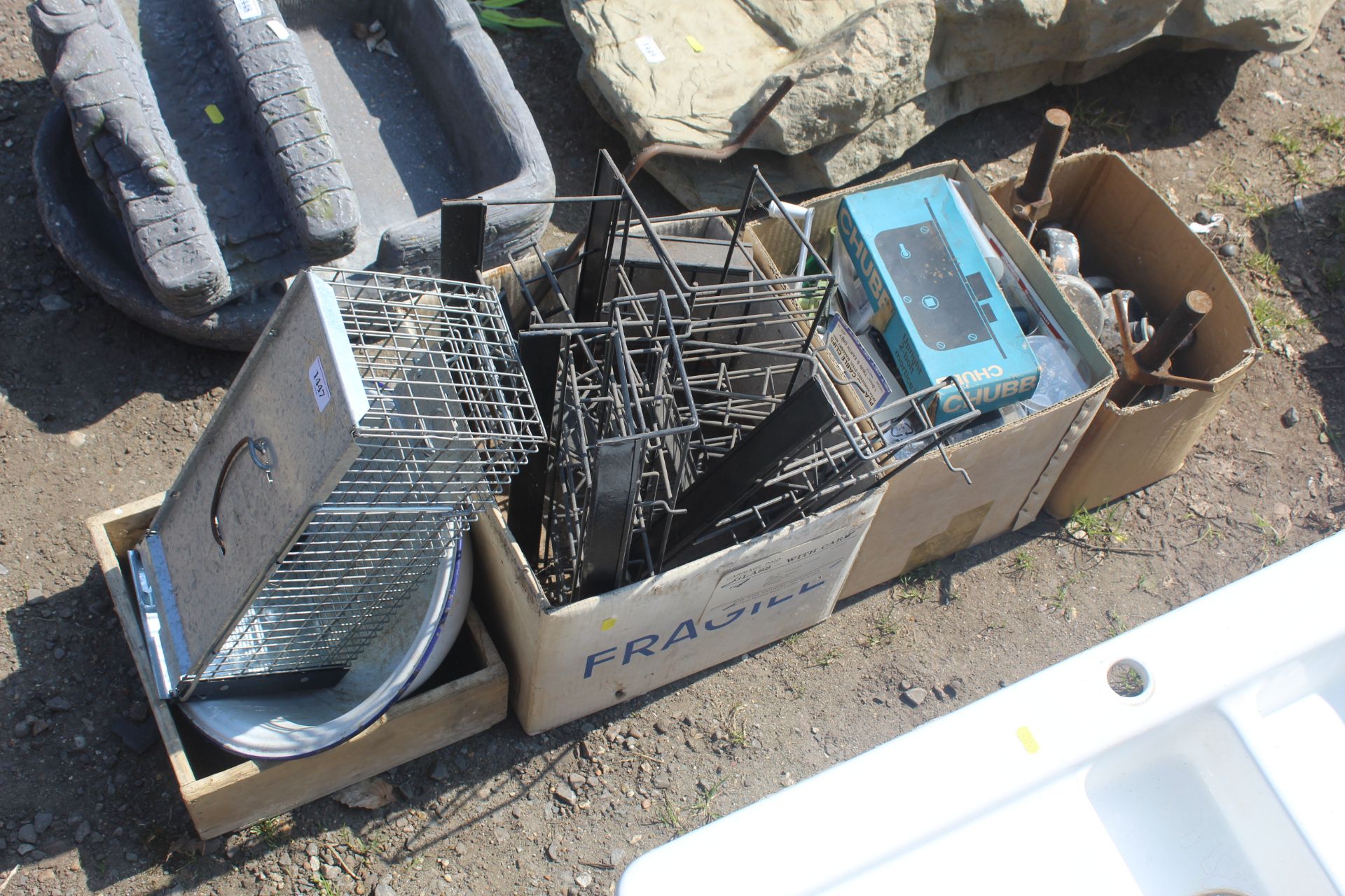 A quantity of various metal ware to include hanging racks, track, castor wheels, an enamel bowl