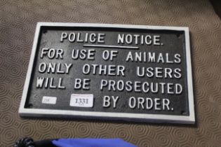 A painted cast iron sign for "Police Notice - for