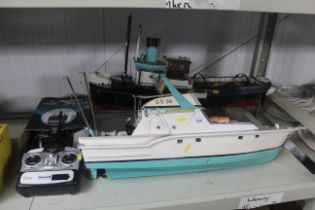 Two radio controller boats and controllers