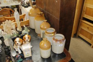 A collection of stoneware bottles and jars