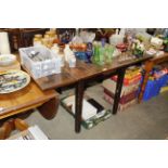 An oak draw leaf table and set of four chairs