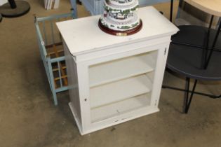 A white painted and glazed wall cabinet