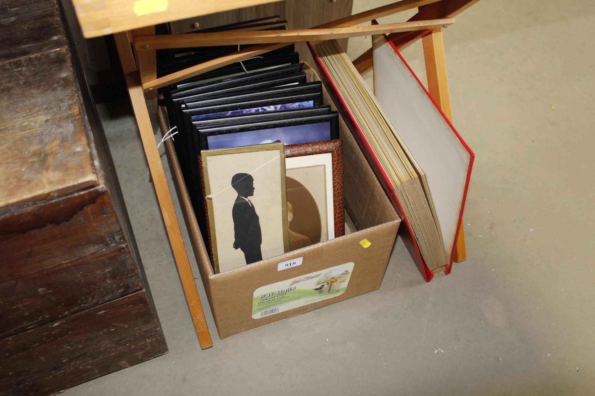 A box of pictures and prints together with an album of photographs