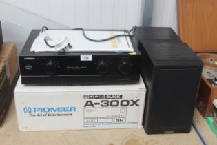A Pioneer stereo amplifier A-300X and a pair of Mi
