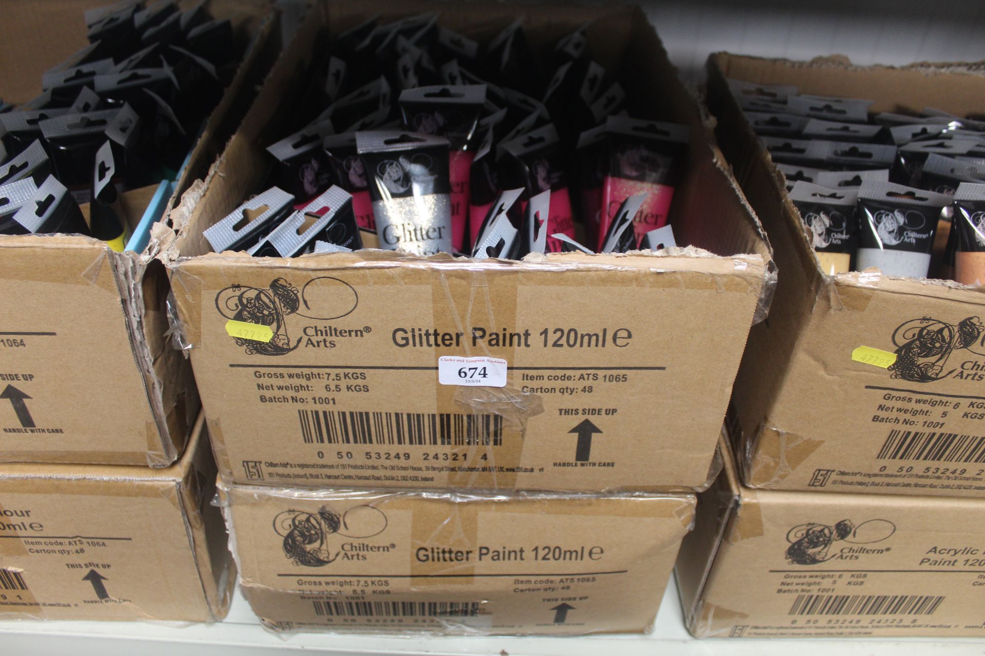 Two boxes containing a quantity of glitter paints