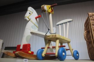 A children's toy rocking horse and push along toy