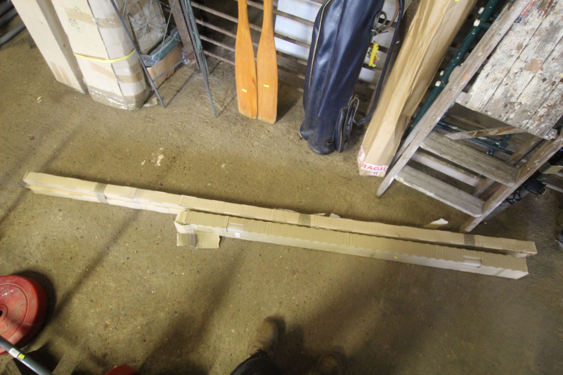 Two fluorescent light strips and two lengths of shaped cornice beams