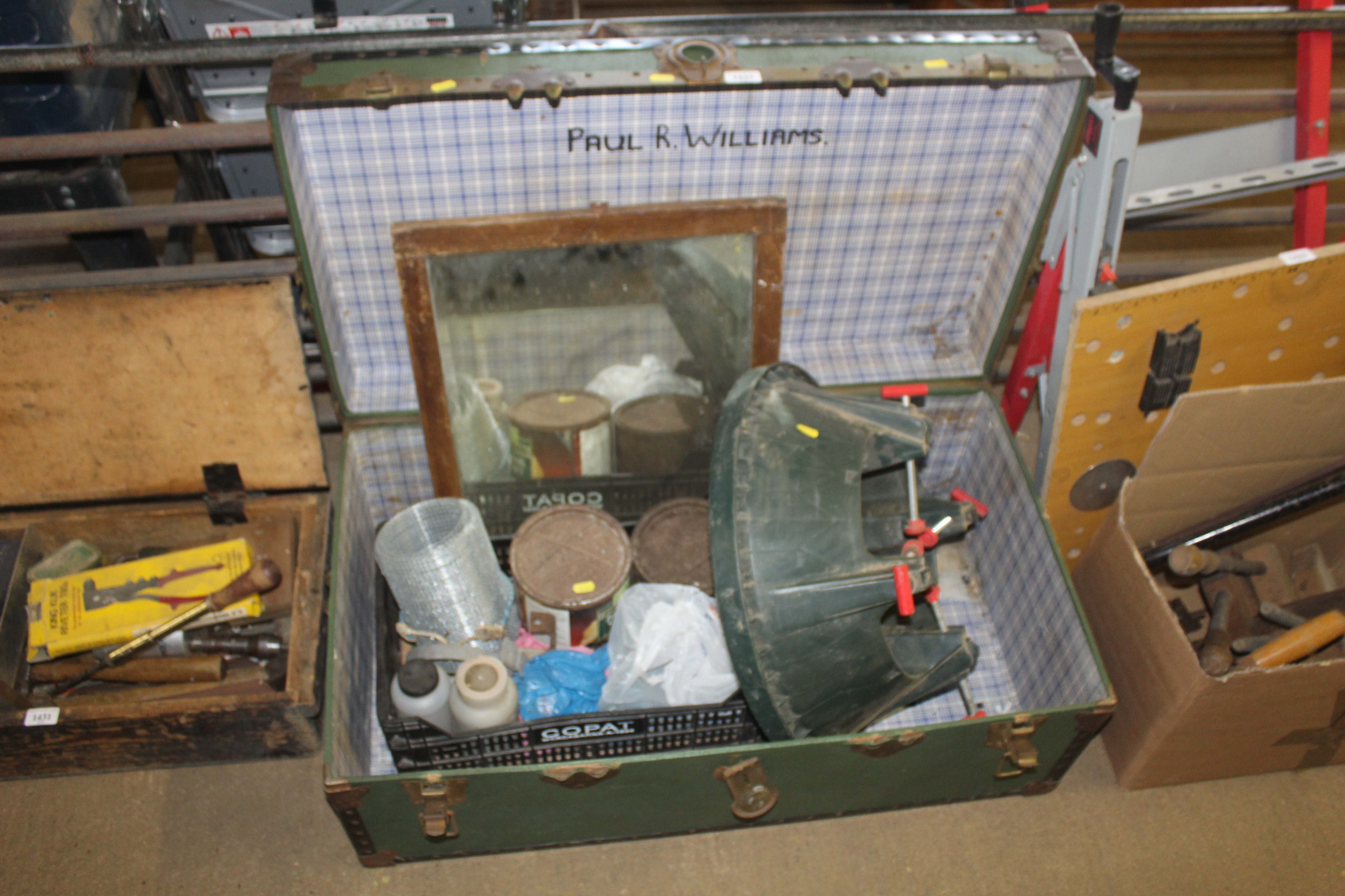 A metal bound storage trunk and contents of plasti