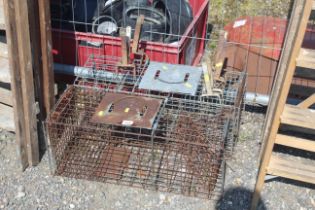 Two rabbit traps and various mole traps