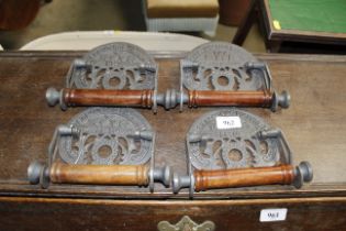 Three reproduction toilet roll holders (106)