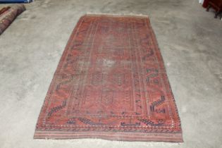 An approx. 9' x 4'6" patterned rug AF