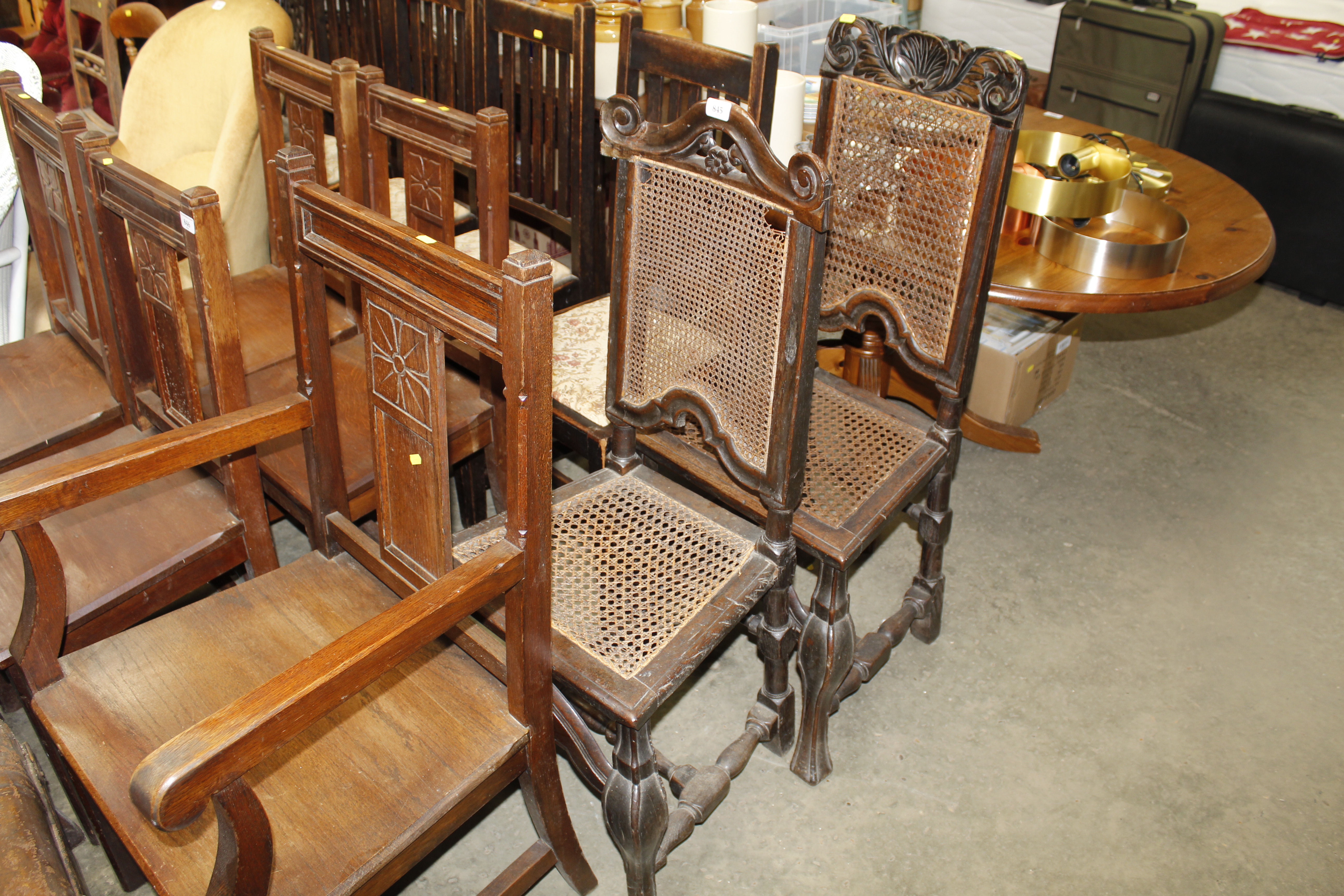 Two antique oak and cane back chairs