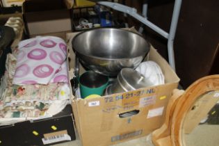 A box containing stainless steel bowl and kitchen