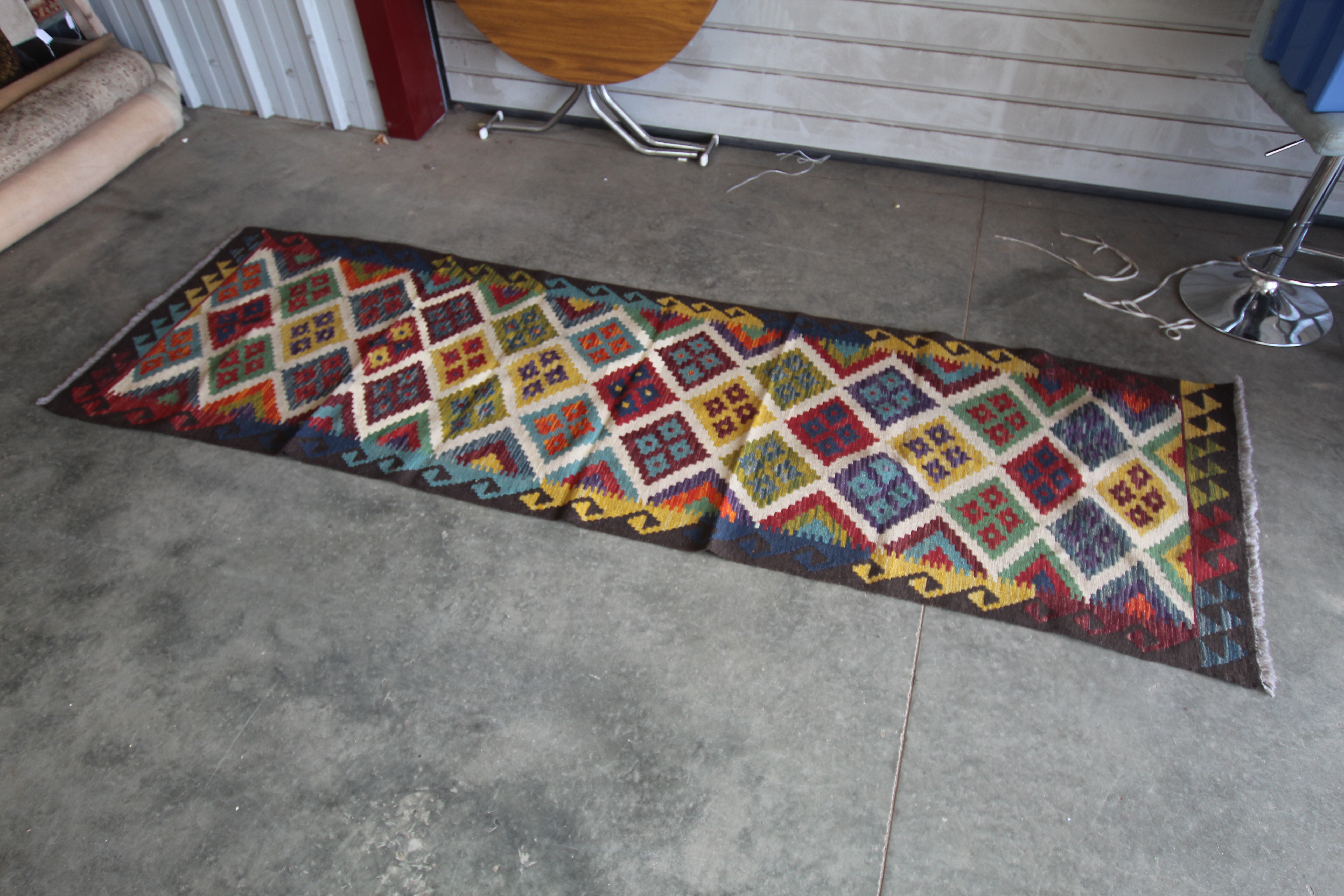 An approx. 9'5" x 2'8" Maimana Kilim runner