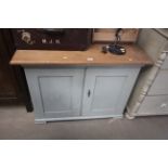 A part painted pine side cupboard