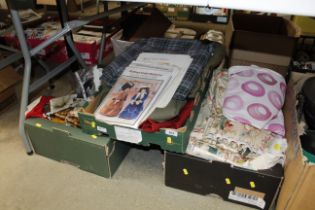 Three boxes containing curtains, textiles and patt