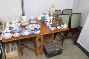 A mid 20th Century teak drop leaf table and four c