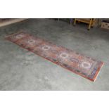 An approx. 9'4" x 2'4" pattern rug