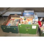 Two boxes of board games and puzzles