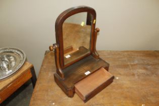 A Victorian mahogany swing framed mirror, fitted s