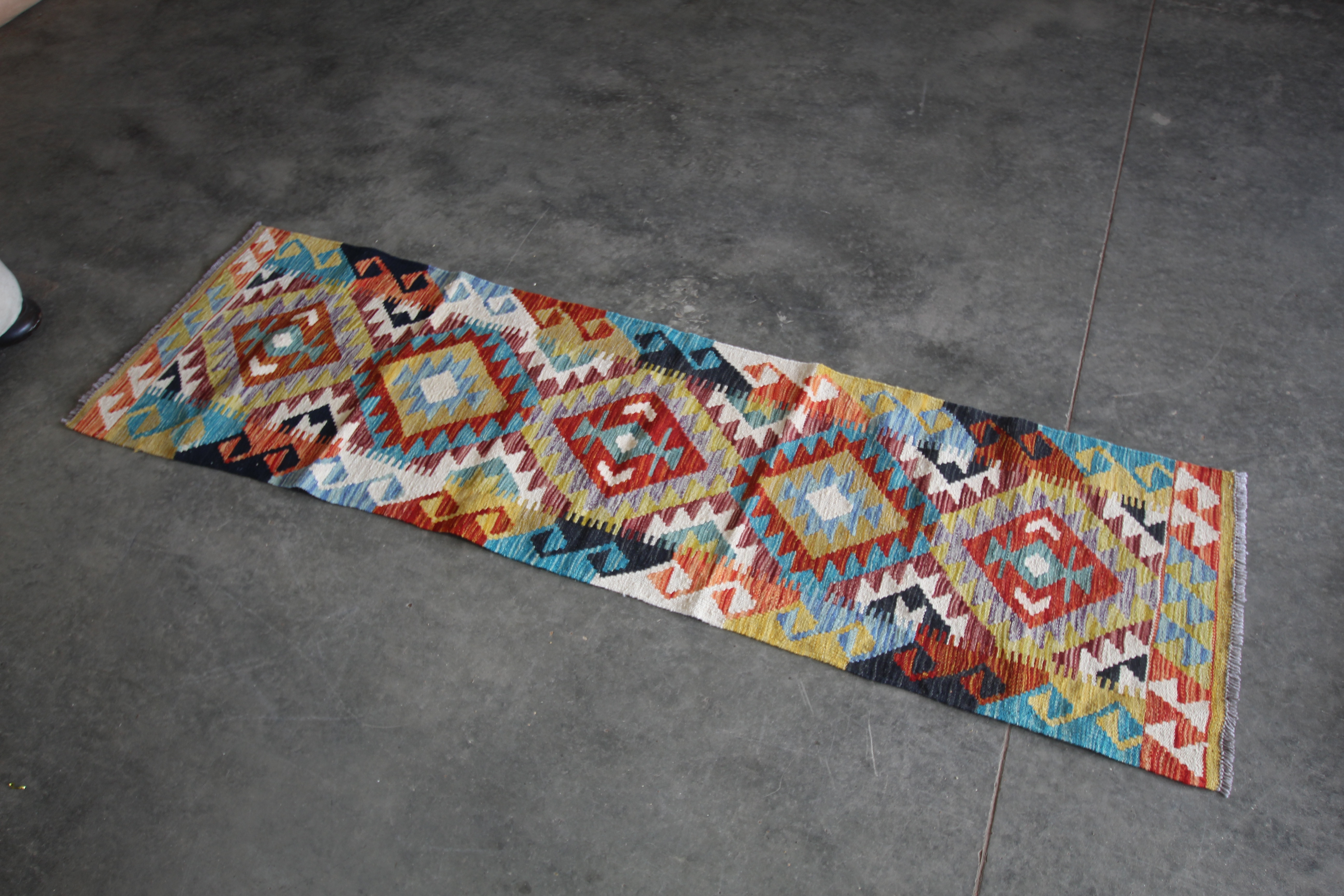 An approx. 6'8" x 1'11" Chobi Kilim runner