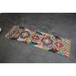 An approx. 6'8" x 1'11" Chobi Kilim runner