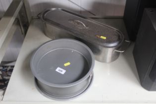 A stainless steel fish kettle and cake tin