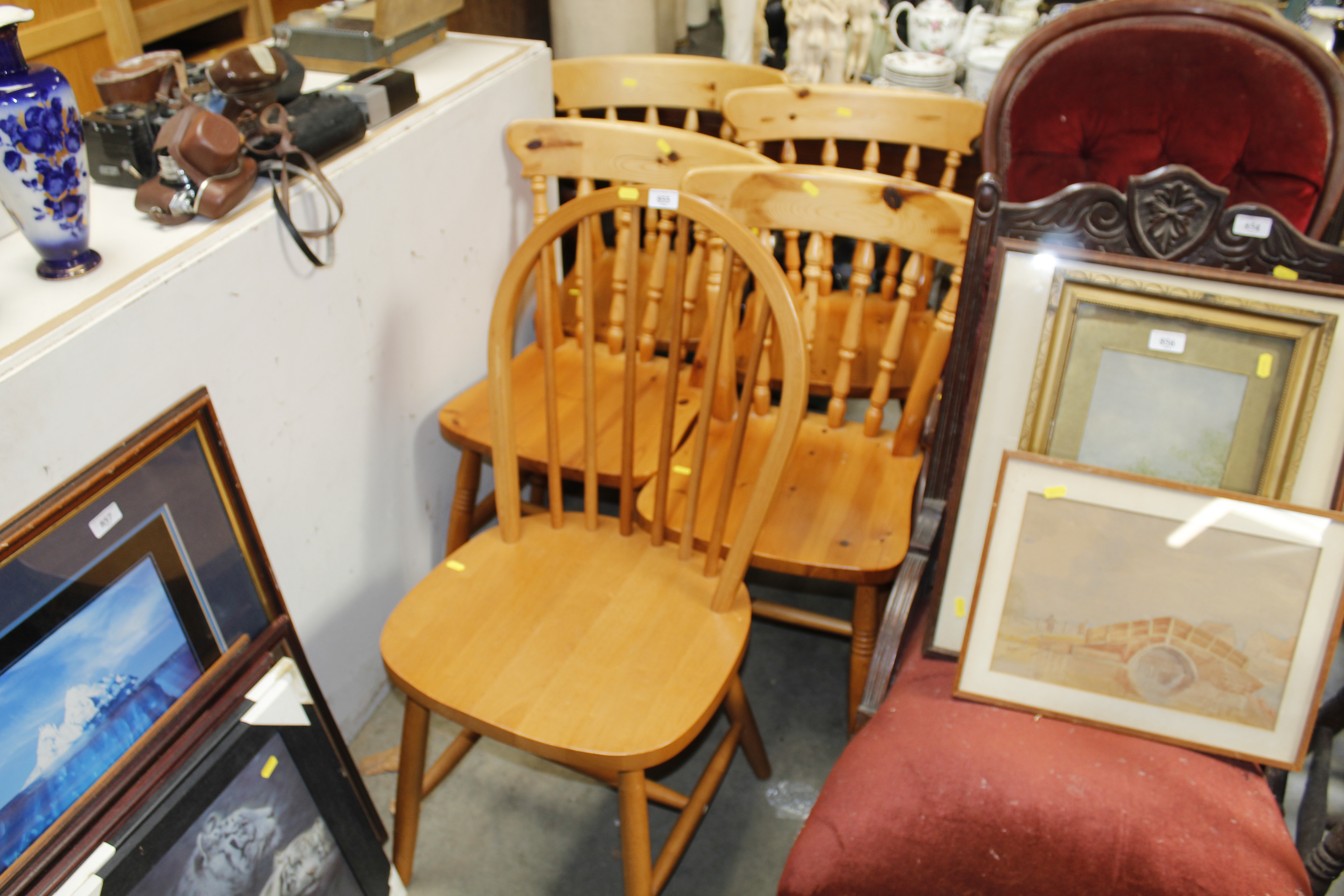 Four pine spindle back kitchen chairs and a stick