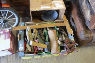 A tray box containing tools to include wooden meas