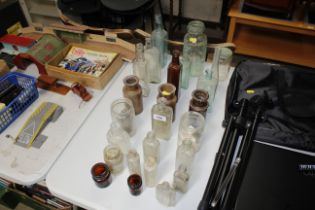 A collection of vintage glass and stoneware bottle