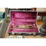 A brass trumpet in fitted case