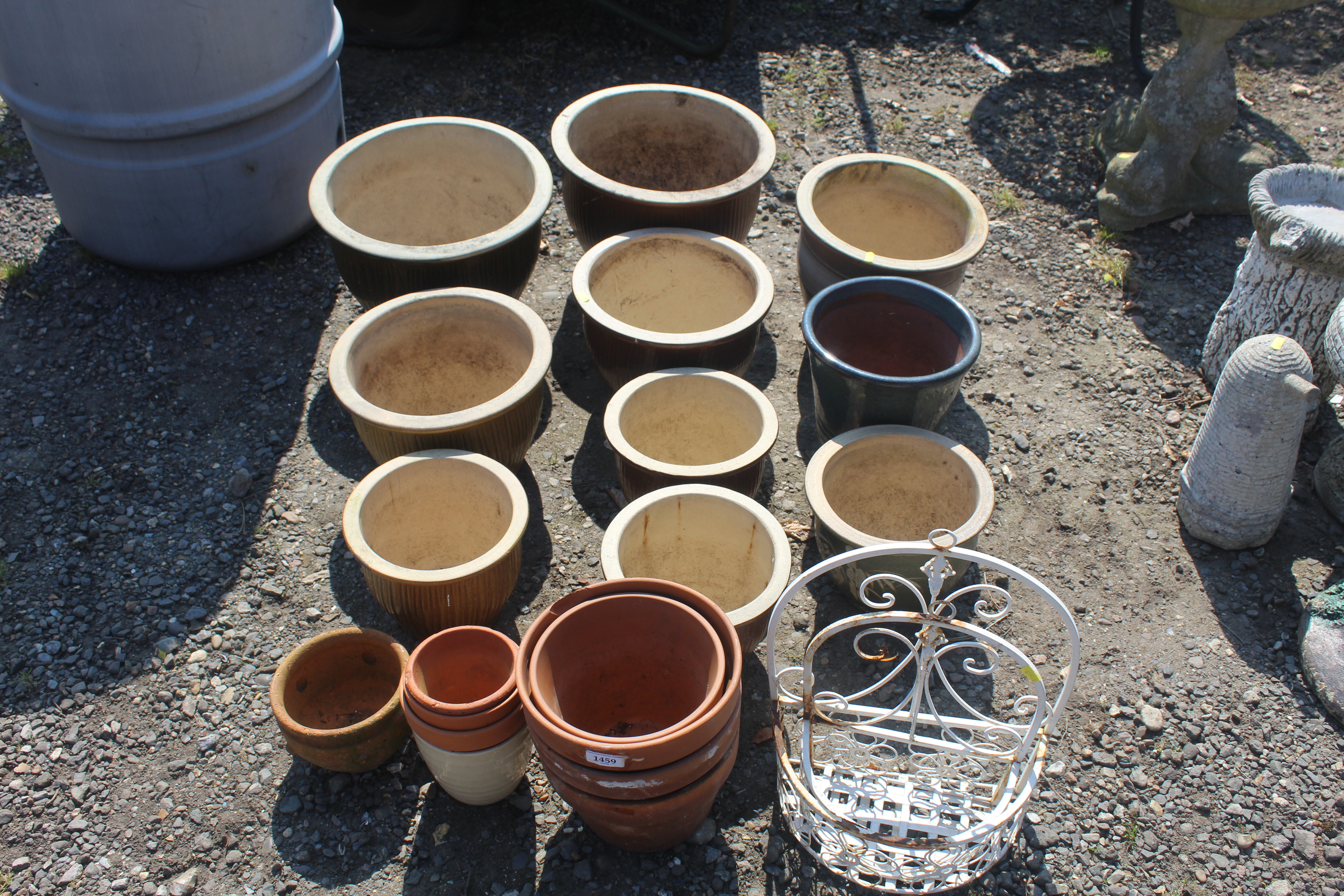 A quantity of various glazed and terracotta plant