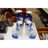 A pair of floral decorated blue and white vases an