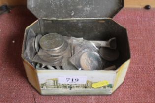 A tin containing various coinage