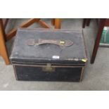 A vintage leather and canvas trunk