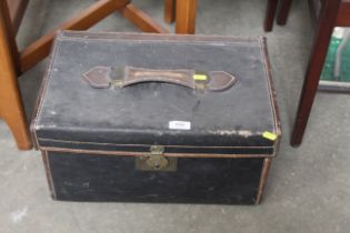 A vintage leather and canvas trunk