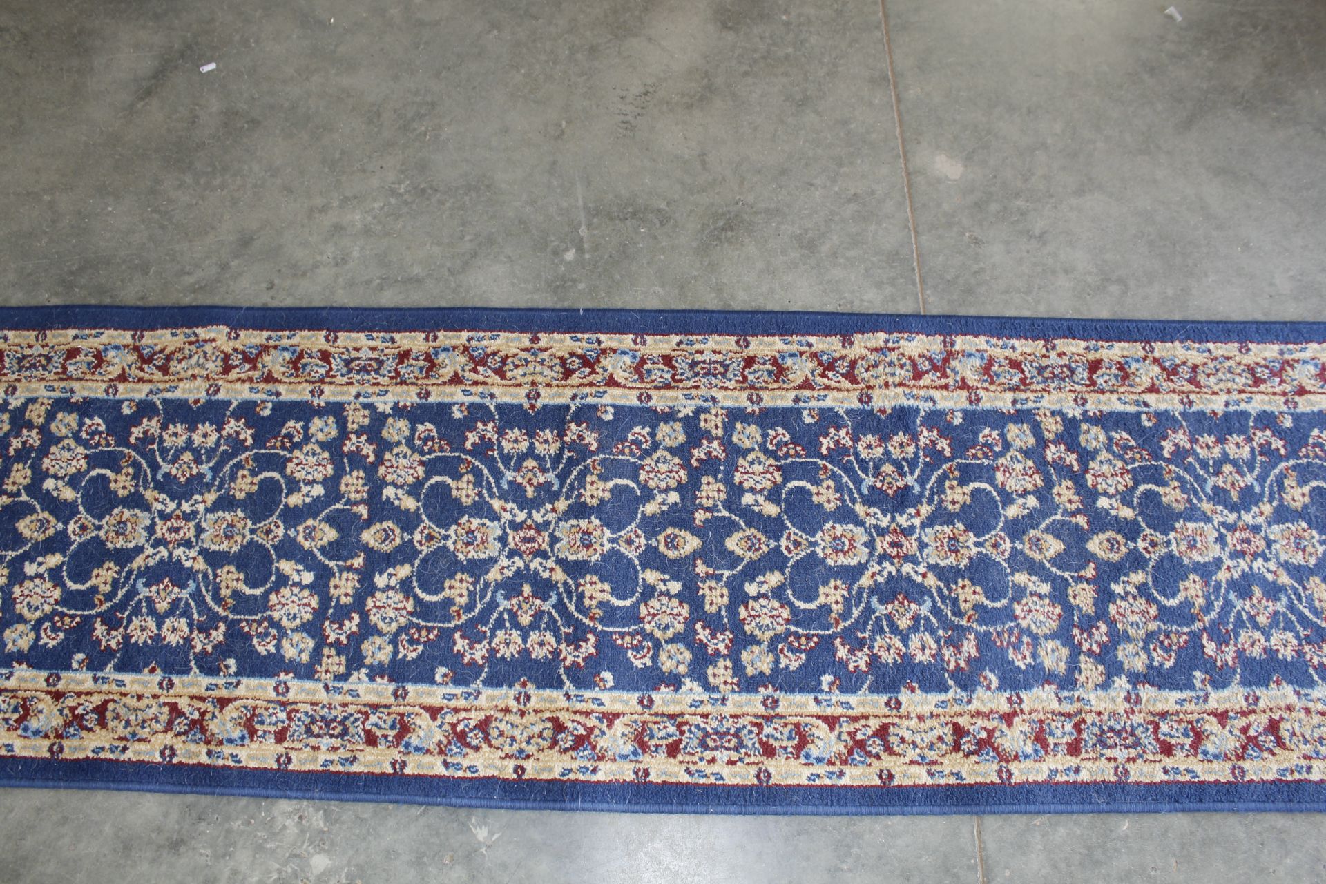 An approx. 9'11" x 2'2" blue pattern rug - Image 2 of 4