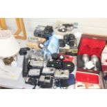 A collection of various cameras and accessories