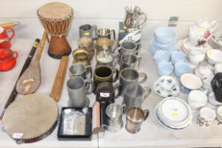A collection of metal ware to include tankards and