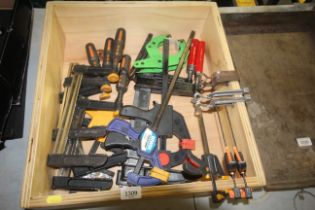 A box containing a quantity of assorted clamps, F