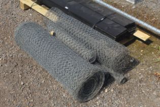 A quantity of part rolls of chicken wire